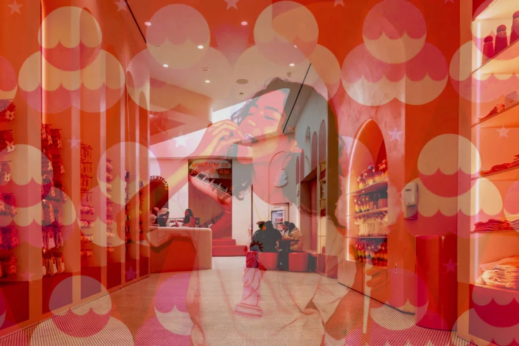 A pink, patterned corridor at the Museum of Ice Cream NYC with a visible sign and colorful interior details, matching the signature aesthetic.