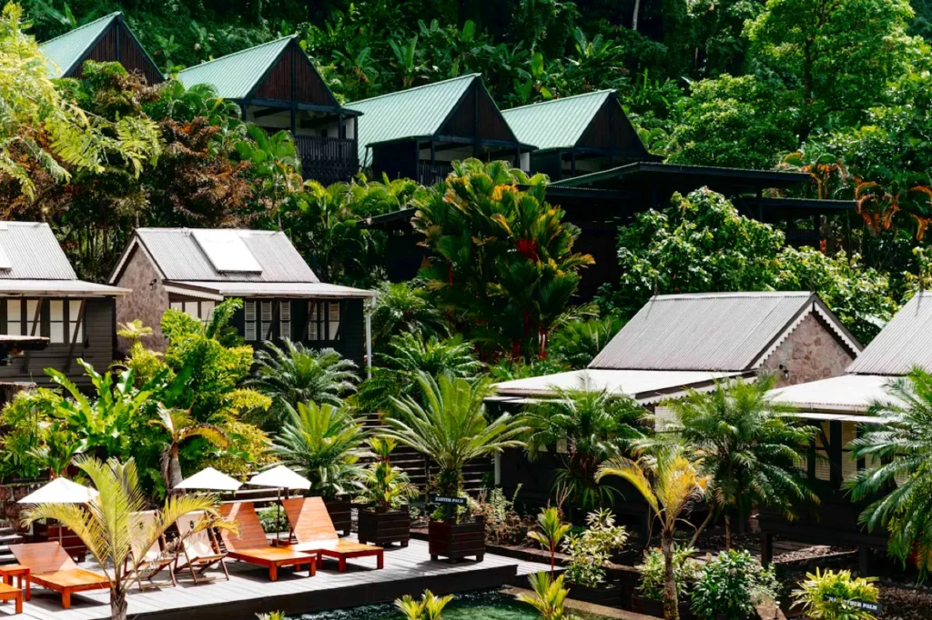 Surrounded by lush tropical green foliage, Hotel Chocolat’s Rabot Hotel in Saint Lucia sits among cocoa-estate grounds with many bungalows and terraced plants.