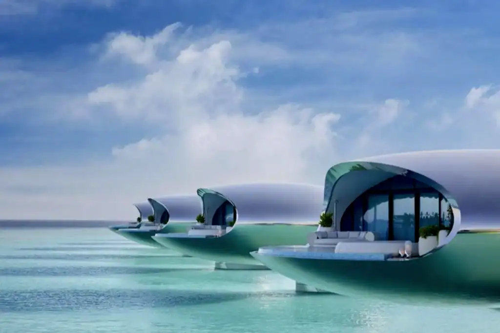 Mirrored stainless-steel spheres from Shebara Resort hover above the Red Sea, their surfaces blending with the horizon and sky in Saudi Arabia.