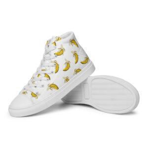 White high-top women’s canvas shoes with a bold banana print, lace-up front, and clean rubber outsole detail with matching tones.