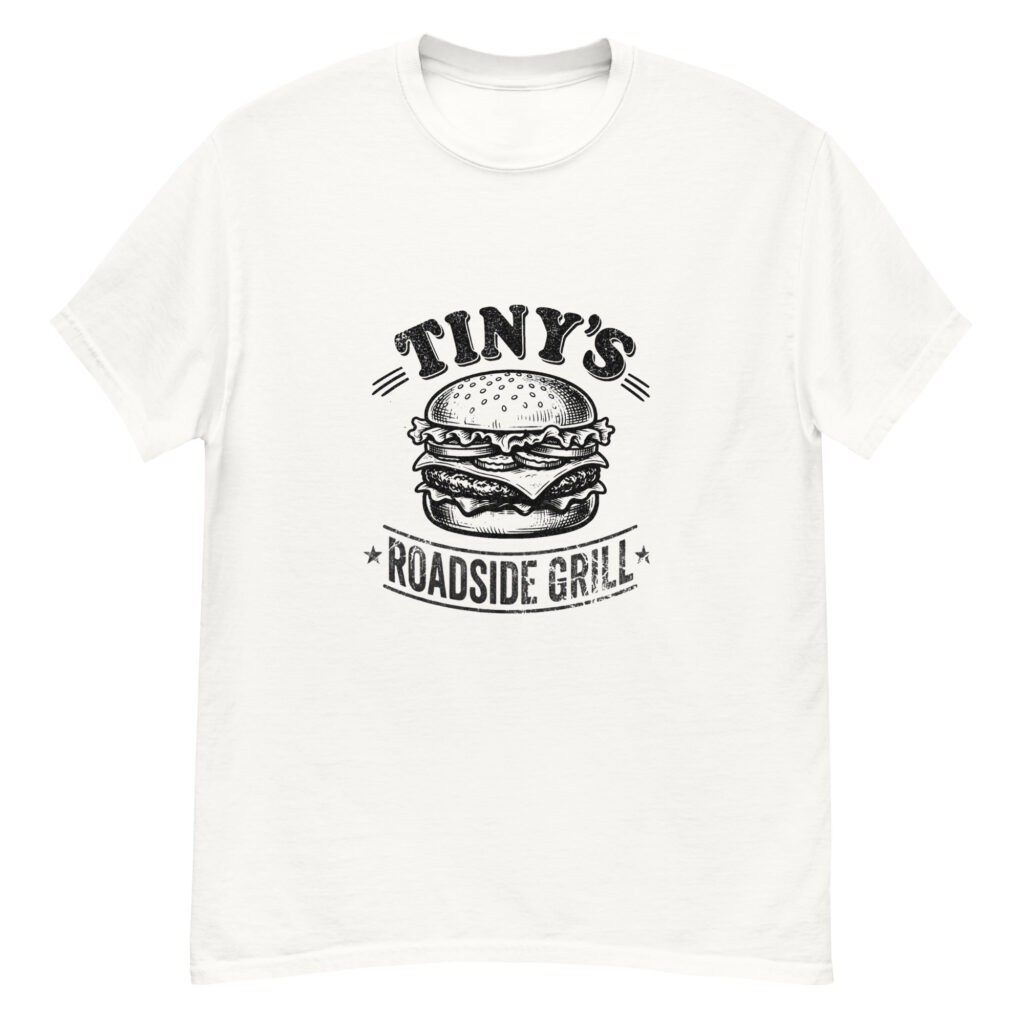 White unisex classic tee with bold TINY’S ROADSIDE GRILL lettering above a burger graphic, with small star details at the base.